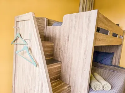 a bunk bed in a room with a closet at Mossy Forest Family Retreat III, 2-8pax, Sunrise View, Cameron Highlands in Cameron Highlands