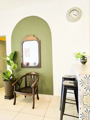 a chair in a room with a mirror at Mossy Forest Family Retreat III, 2-8pax, Sunrise View, Cameron Highlands in Cameron Highlands