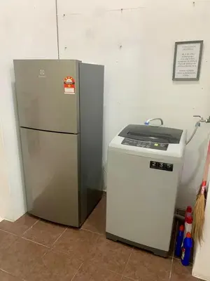 a refrigerator sitting next to a small freezer at Impiana Inn Seri Manjung in Seri Manjung