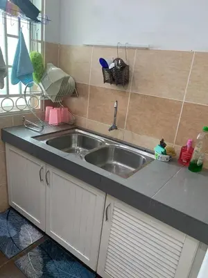 a kitchen with a sink and a counter top at Impiana Inn Seri Manjung in Seri Manjung