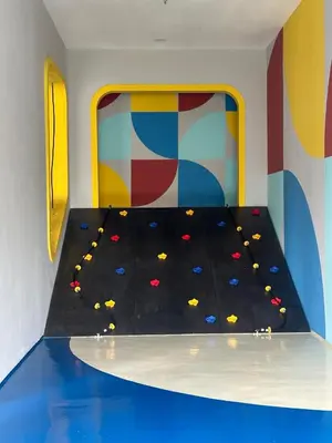 an indoor play room with a climbing wall at Apartment in Batu Kawan in Batu Kawan