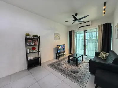 a living room with a couch and a ceiling fan at Royal Comfort Suite Meritus near swimming pool in Perai