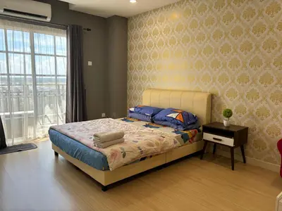 a bedroom with a bed and a window at KF Homestay Premium Suite in Kampar