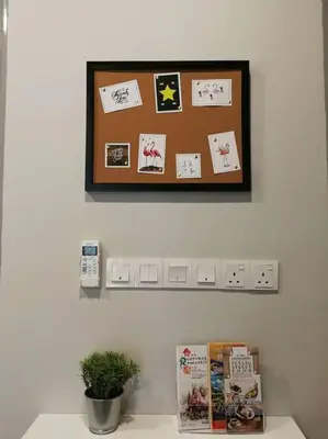 a wall with a clock and a shelf with cards at Heritage Studio in UNESCO Zone near to StreetArt & Town 2 in George Town