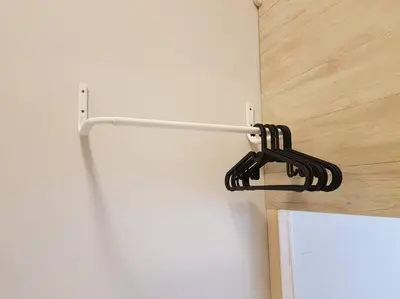 a metal towel rack on a white wall at Heritage Loft on Beach Street near UNESCO Zone & Street Art 1 in George Town