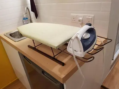 a hair dryer on a counter in a kitchen at Heritage Loft on Beach Street near UNESCO Zone & Street Art 2 in George Town