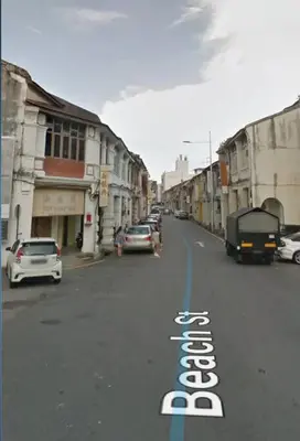 a street with cars parked on the side of the road at Heritage Loft on Beach Street near UNESCO Zone & Street Art 3 in George Town