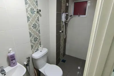 a bathroom with a toilet and a sink at Kamilia Homestay Anderson Ipoh in Ipoh