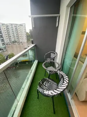 two chairs sitting on the balcony of a building at Nature's Sanctuary at Tanah Rata in Tanah Rata