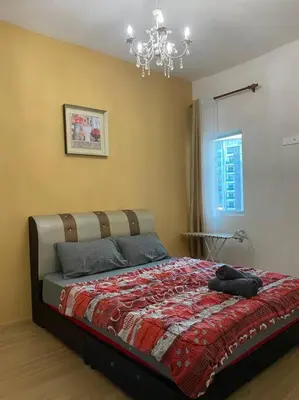 a bedroom with a bed with a stuffed animal on it at Nature's Sanctuary at Tanah Rata in Tanah Rata