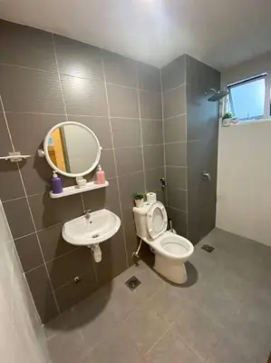 a bathroom with a toilet and a mirror at Nature's Sanctuary at Tanah Rata in Tanah Rata