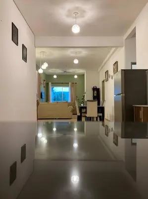 a view of a kitchen and a living room at Nature's Sanctuary at Tanah Rata in Tanah Rata