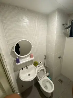 a small bathroom with a toilet and a sink at Nature's Sanctuary at Tanah Rata in Tanah Rata