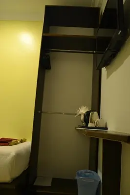 a cupboard in a room with a bunk bed at DR Hotel Penang in Bayan Lepas
