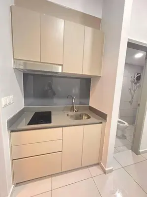 a small kitchen with a sink and a toilet at Mini Studio in Batu Kawan in Batu Kawan