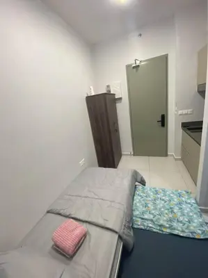 a bedroom with a bed with a pillow on it at Mini Studio in Batu Kawan in Batu Kawan