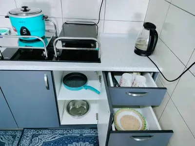 a kitchen counter with a sink and some drawers at Ammara Homestay 3 Palas horizon Kea Farm in Cameron Highlands