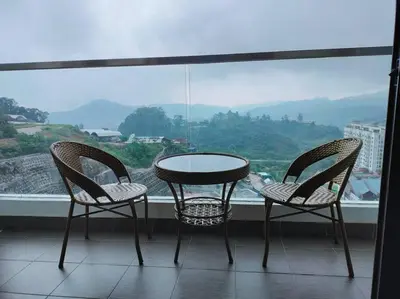 two chairs and a table in front of a window at Ammara Homestay 3 Palas horizon Kea Farm in Cameron Highlands