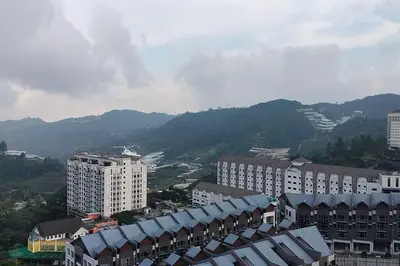 an aerial view of a city with buildings and mountains at Ammara Homestay 3 Palas horizon Kea Farm in Cameron Highlands