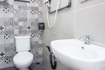 a bathroom with a toilet and a sink at Plumeria 5BR Garden House by uBook in Butterworth