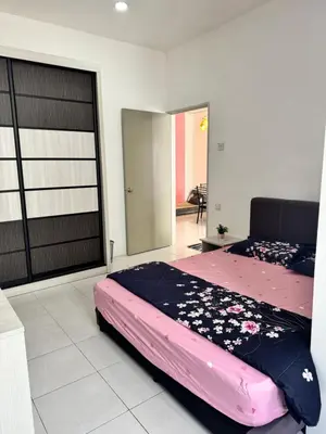 a bedroom with a large pink bed in a room at AYAAN LAVISH HOMESTAY with FREE WiFi in Tanah Rata