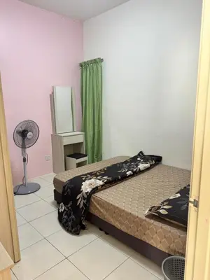 a bedroom with two beds and a fan at AYAAN LAVISH HOMESTAY with FREE WiFi in Tanah Rata