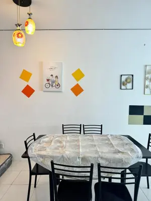 a dining room with a table and chairs at AYAAN LAVISH HOMESTAY with FREE WiFi in Tanah Rata