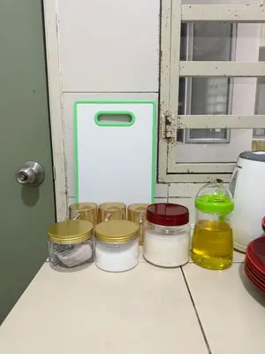a row of jars sitting on top of a counter at AYAAN SERENE BUDGET HOMESTAY with FREE WiFi and Netflix in Tanah Rata