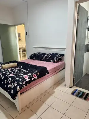 a bedroom with a bed and a mirror at AYAAN SERENE BUDGET HOMESTAY with FREE WiFi and Netflix in Tanah Rata