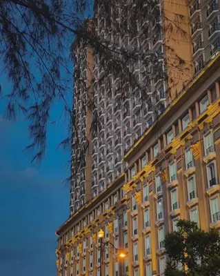 a tall building in front of a building at KF Homestay Double Suite in Kampar