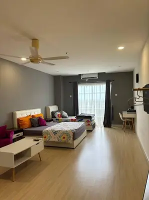 a living room with a bed and a couch at KF Homestay Double Suite in Kampar