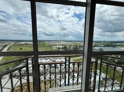a view of a city from a window in a building at KF Homestay Deluxe Suite in Kampar