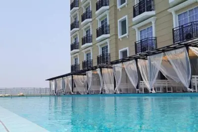 a large swimming pool next to a building at KF Homestay Deluxe Suite in Kampar
