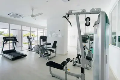 a gym with several exercise equipment in a room at Purrfect Nook 1BR Georgetown Straits Garden \u4e00\u623f\u4e00\u5385\u5f0f in Jelutong