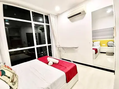 a bedroom with a bed and a large window at Purrfect Nook 1BR Georgetown Straits Garden \u4e00\u623f\u4e00\u5385\u5f0f in Jelutong