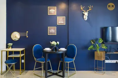 a blue room with a table and blue chairs at Navy Studio at Tropicana 218 at Central Location & Food Hunt Friendly in George Town