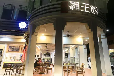 a restaurant with tables and chairs in a building at Navy Studio at Tropicana 218 at Central Location & Food Hunt Friendly in George Town