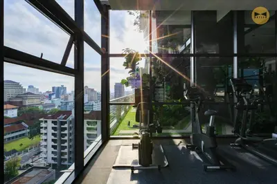 a gym with a view of a city at Navy Studio at Tropicana 218 at Central Location & Food Hunt Friendly in George Town
