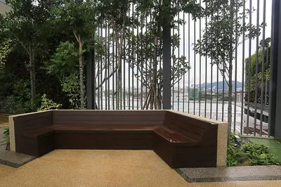 a bench sitting in front of a fence at Seaview Sunrise 1BR at Tropicana 218 at Central Location & Food Hunt Friendly in George Town