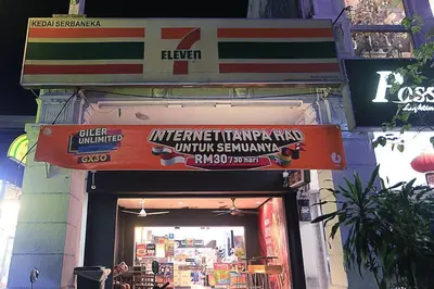 an entrance to a restaurant with a sign above it at Spacious 3BR in Tropicana 218 at Central Location & Food Hunt Friendly in George Town