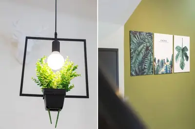 a light hanging on a wall with a potted plant at Landed 3BR Home Near Beach, Seafood & Fisherman Village in Bayan Lepas