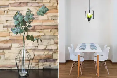 a dining room with a table and a vase with a plant at Landed 3BR Home Near Beach, Seafood & Fisherman Village in Bayan Lepas