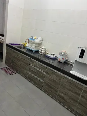 a counter in a kitchen with some food on it at Homestay Cactus Apparment in Brinchang