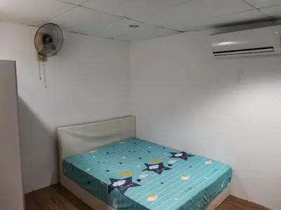 a small bed in a room with a ceiling at Amoy Lane Hostel Penang in George Town