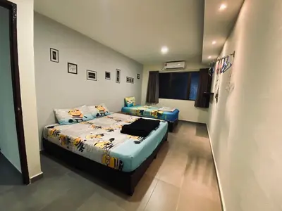 a bedroom with two beds in a room at Ipoh Budget in Ipoh
