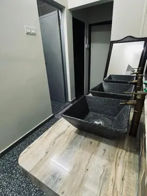 a bathroom with a sink on the floor next to stairs at Ipoh Budget in Ipoh