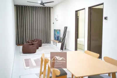 a dining room with a table and chairs at HAZZ Homestay Kulim IV in Kulim