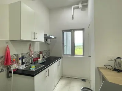 a kitchen with white cabinets and a sink and a window at Ipoh Town Centre The Anderson For 5pax in Ipoh