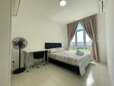 a bedroom with a bed and a desk and a window at Ipoh Town Centre The Anderson For 5pax in Ipoh