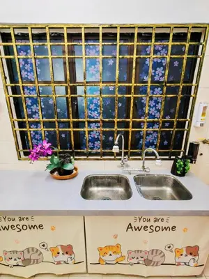 a kitchen sink with a view of the stars in the window at GOLDEN HOUSE ,1min to aeon, 7min to zoo,8min to lake gardens in Taiping
